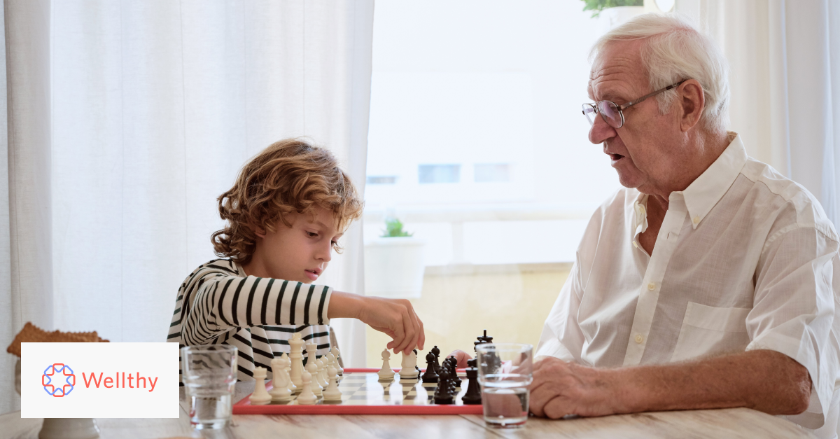 Person playing chess with their grandchild