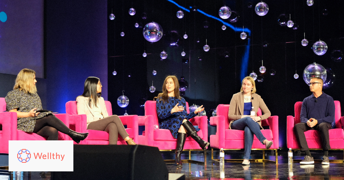 A photo of Wellthy CEO Lindsay Jurist-Rosner sitting on-stage alongside Connie Chen, Lian Neeman, and Brian Bloom at the HLTH conference.