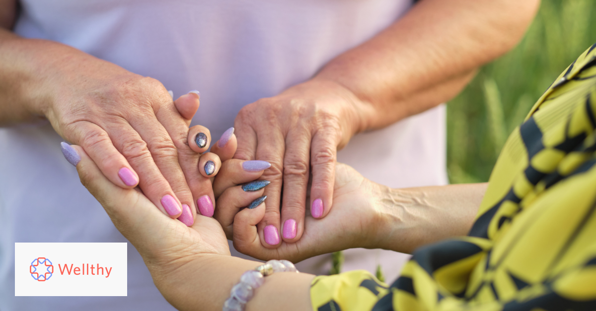 A close-up image of a mom and daughter's hands holding onto one another.