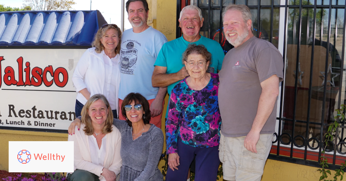 This is a picture of Wellthy member Elaina's family, outside of a restaurant. 